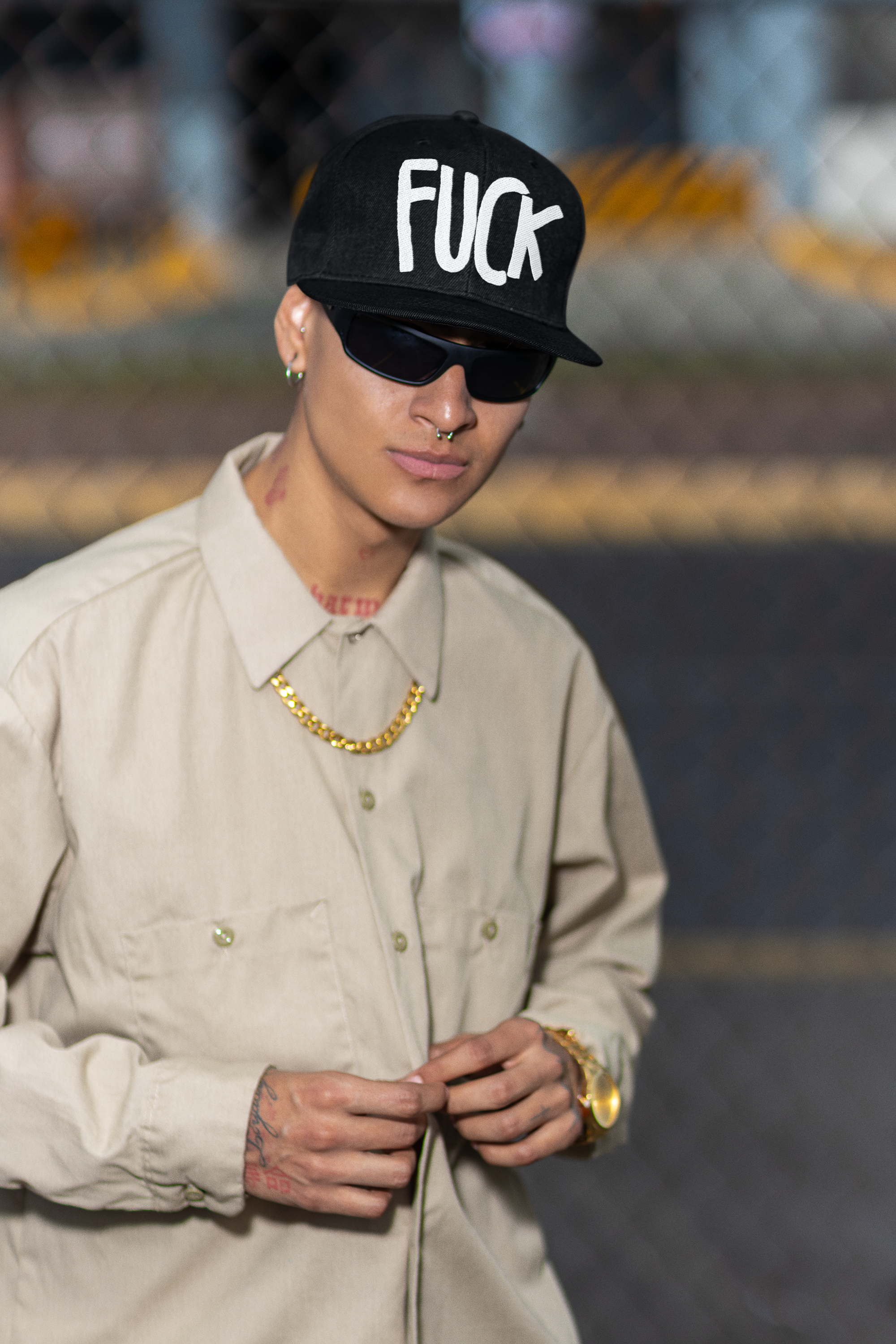 snapback-hat-mockup-featuring-a-tattooed-man-with-a-serious-look-m36839.png