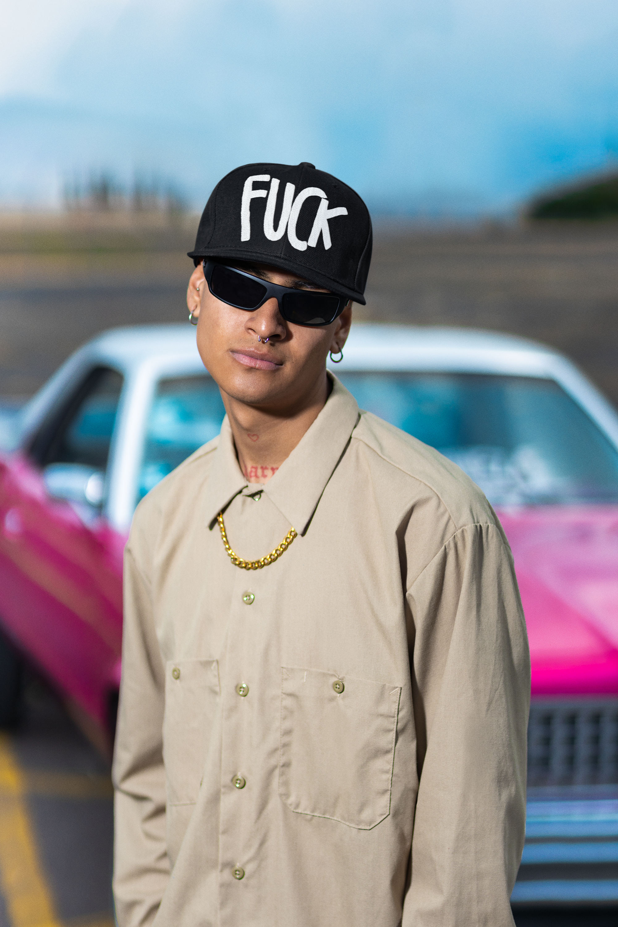 mockup-of-a-man-with-piercings-wearing-a-snapback-hat-and-sunglasses-m36837.png